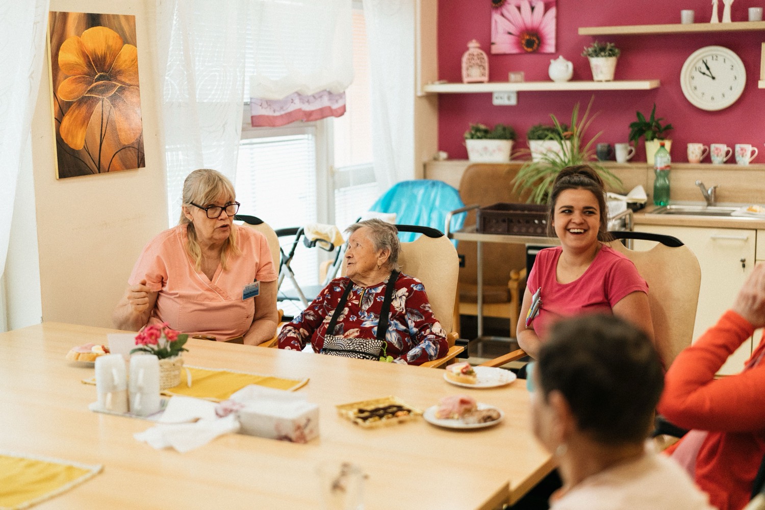 Residents and care staff in the communal area